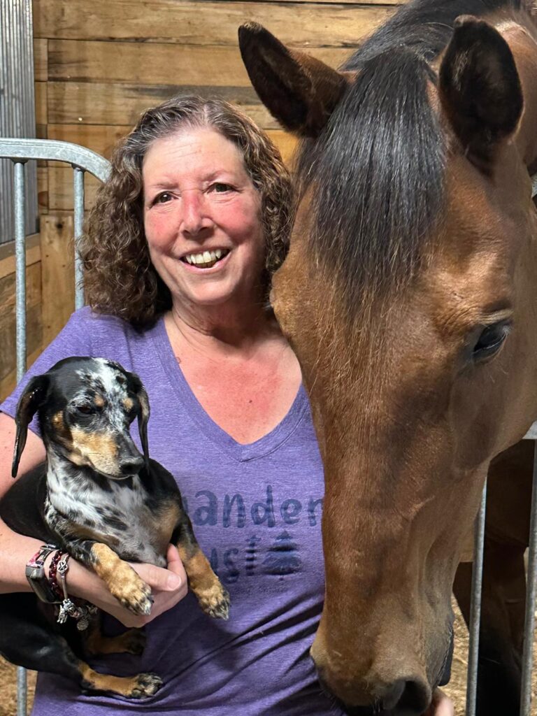 image of Nancy, her horse and dog
